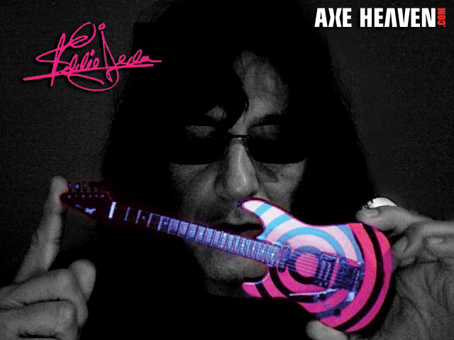 Eddie Ojeda - an AXE HEAVEN® Exclusive Artist - Holding Licensed Miniature Guitar by AXE HEAVEN®