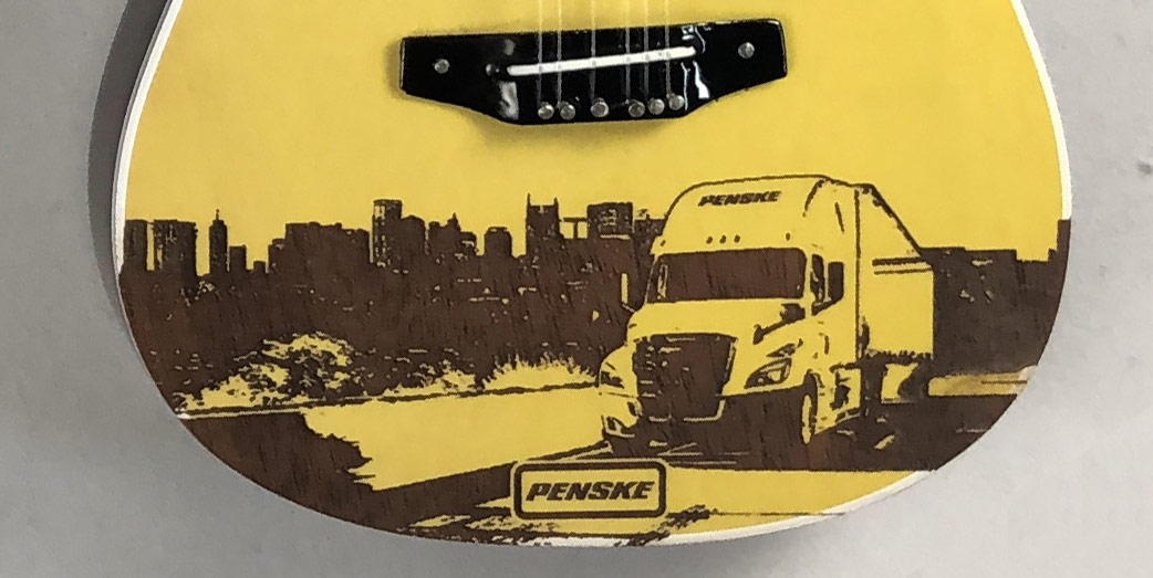 Laser-Engraved Nashville Skyline on Promo Acoustic Mini Guitar for Penske Logistics