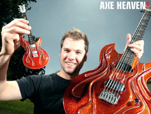 Stephen McSwain - an AXE HEAVEN® Exclusive Artist - Holding Licensed Miniature Flame Guitar by AXE HEAVEN® and Original Flame Guitar by McSwain Guitars