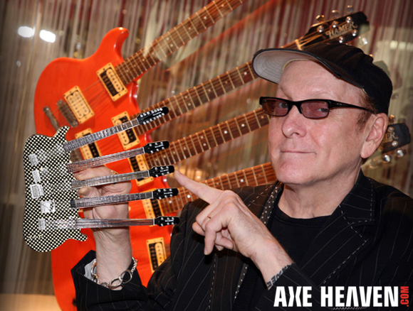 Rick Nielsen - an AXE HEAVEN® Exclusive Artist - Holding Officially Licensed Checkered Five-Neck Miniature Guitar Replica Collectible by AXE HEAVEN®