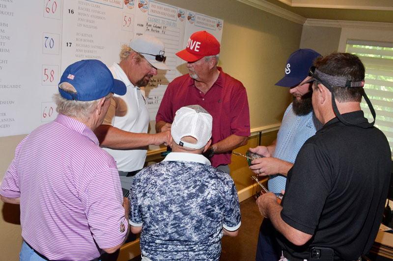 Toby Keith Signs Top Finishers' Golf Trophies at 2021 Golf Tournament Fundraiser