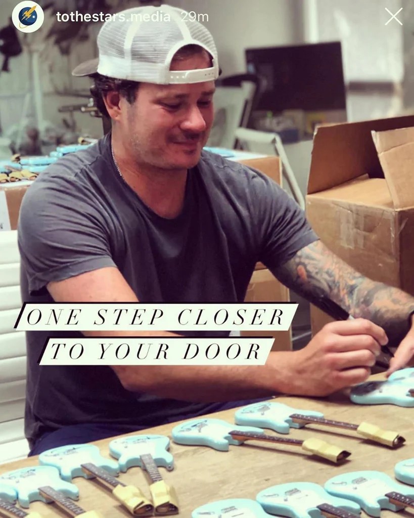Tom DeLonge Autographing Surf Green Fender Strat Mini Guitars