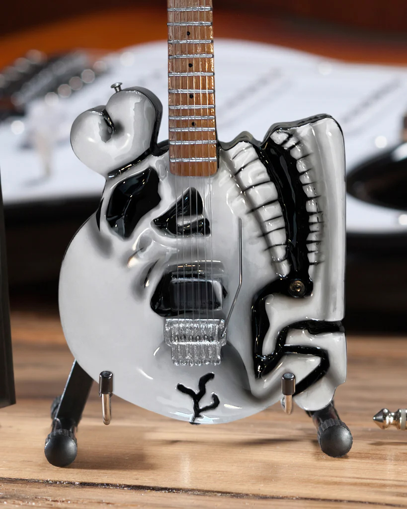 Closeup in A-Frame Stand of Official B.C. Rich® Custom Skull Miniature Guitar Replica - C.C. DeVille - Poison