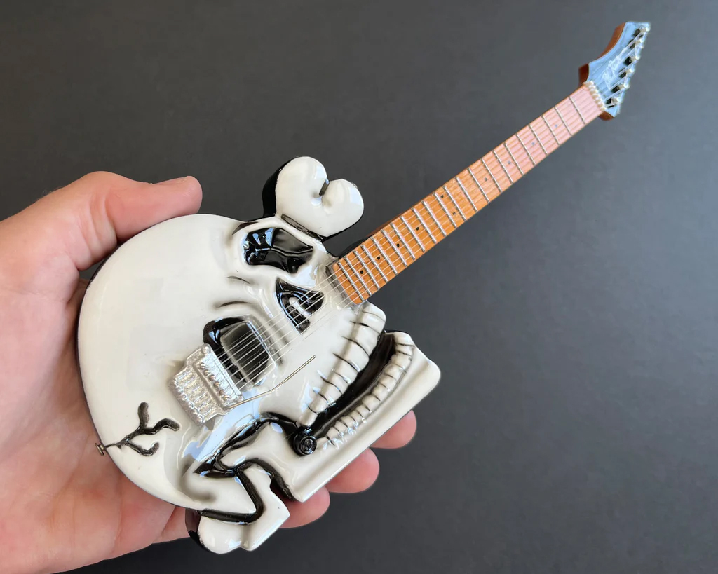 Closeup of Official B.C. Rich® Custom Skull Miniature Guitar Replica - C.C. DeVille - Poison