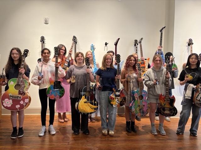 Dogwood Arts Youth Arts Program Artists Hold the Guitars They Painted in 2026